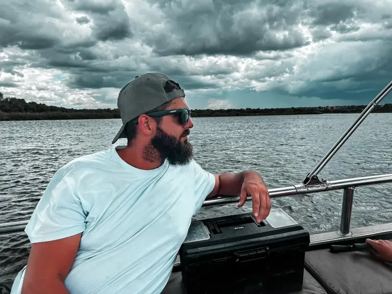 Boeta Louw on the boat, looking out over the water
